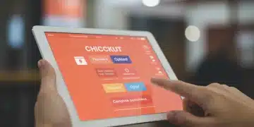 Modern Shopify checkout page on tablet, showing simplified payment options and a hand tapping to complete purchase.